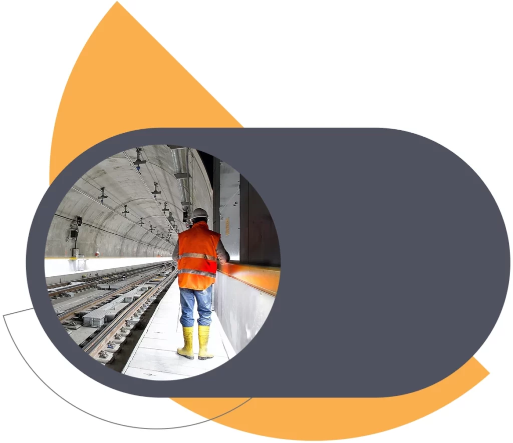 man wearing high vis jacket in a railway tunnel